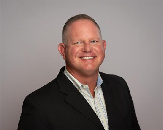 a headshot of Shayne Mehringer